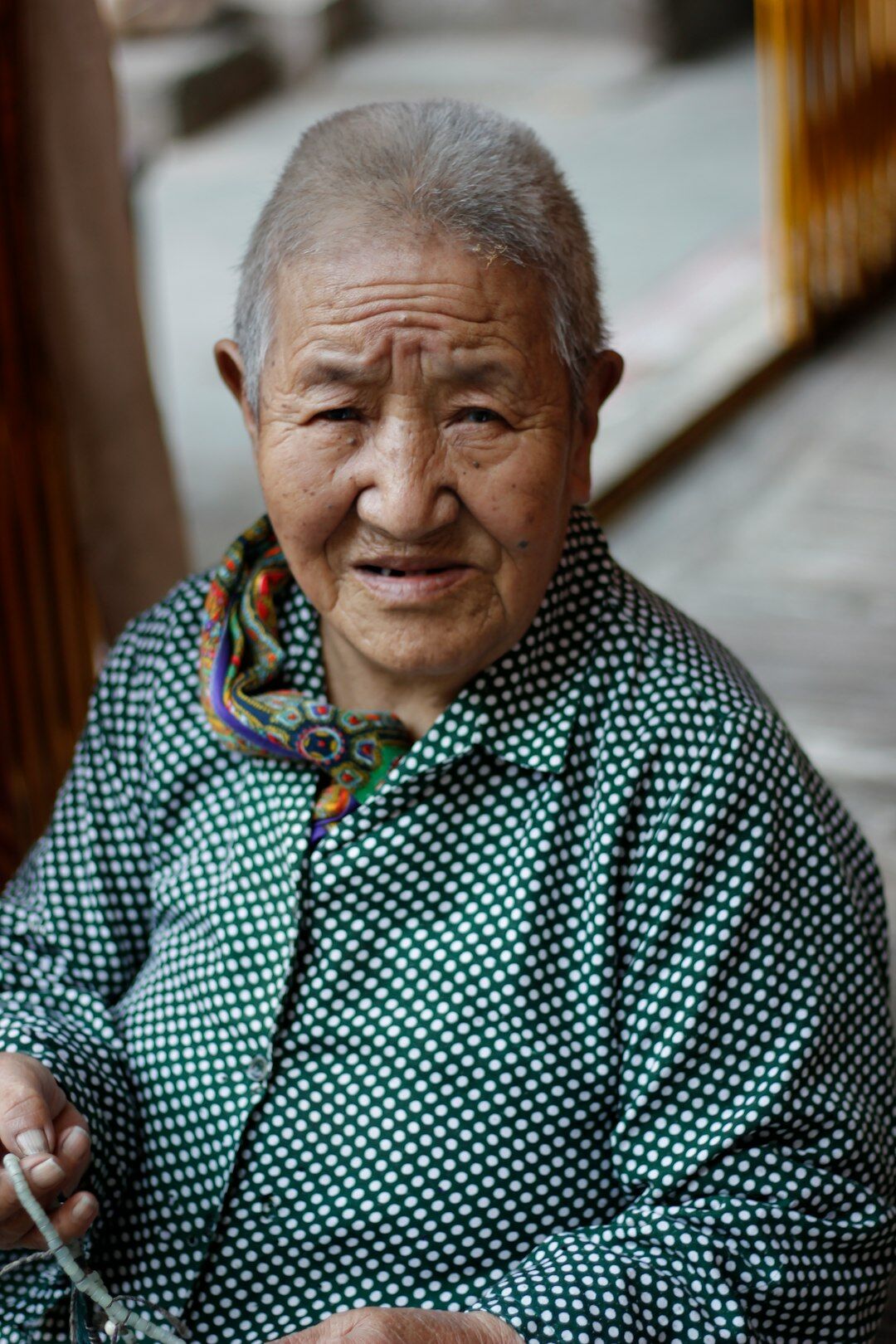 elderly woman weaving